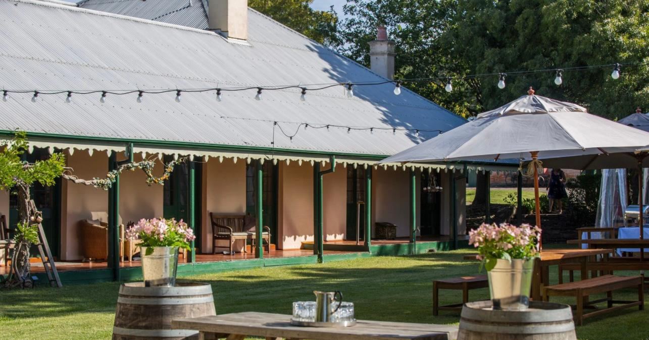 The Flowerdale Estate homestead verandah strung with festoon lights